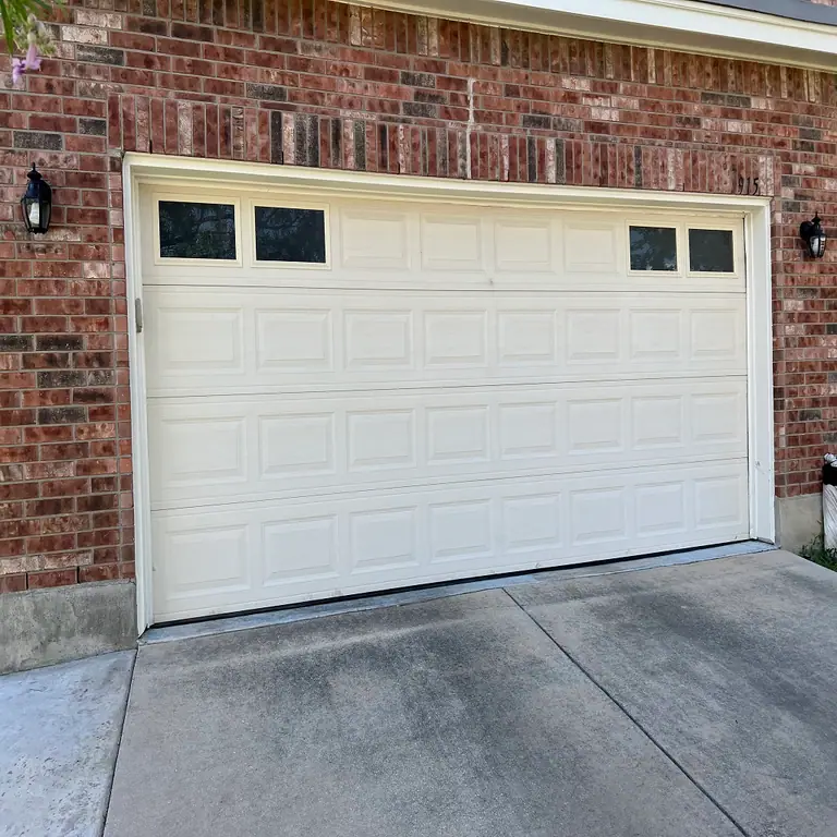 How Much Does It Cost To Repair A Garage Door? A Comprehensive Guide by Garage Door Specialists