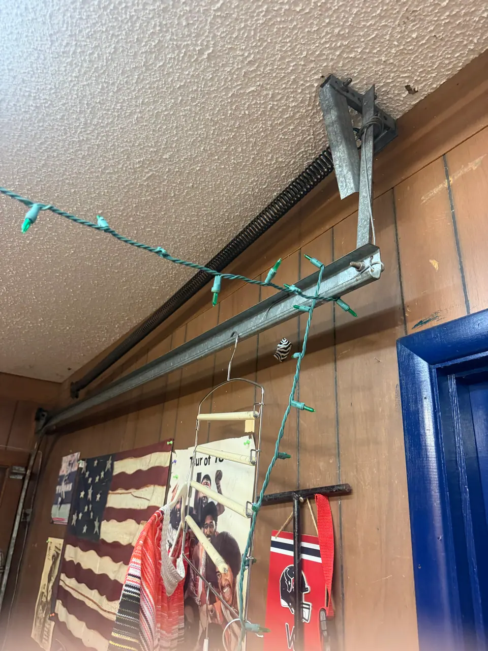 Extension spring and track hardware on a garage door in Converse